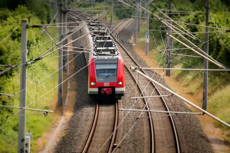 China-Europe Railway Express freight train crossing rail bridge to Europe